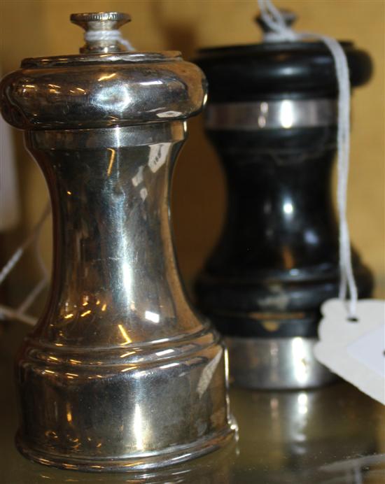 Silver-mounted ebonised pepper mill & another silver pepper mill(-)